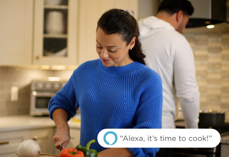Young Business Woman Uses a Voice Command with the Smart Under Cabinet Lighting Young Business Woman Uses a Voice Command with the Smart Under Cabinet Lighting